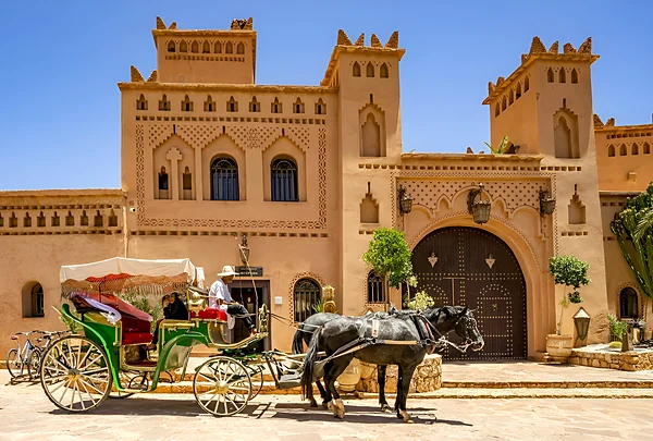 Ksar Ighnda façade with a horse carriage, Ouarzazate