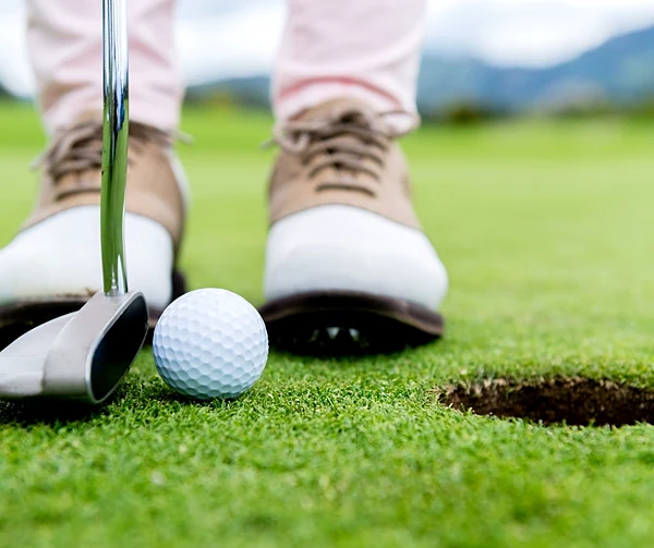 Putting beside the hole on a green